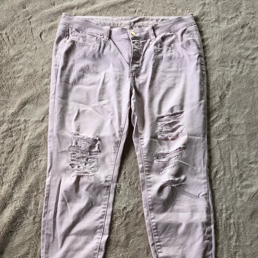 Distressed light pink jeans